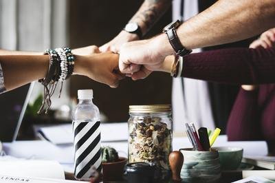 WMS implementation team - fist bump WMS implementation team - fist bump
